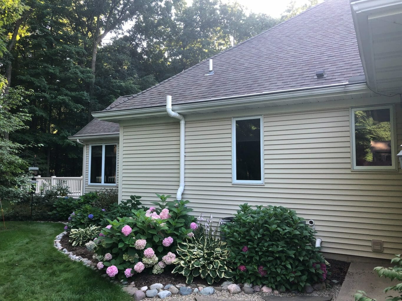 A photo of a radon mitigation system installed on a home's exterior.
